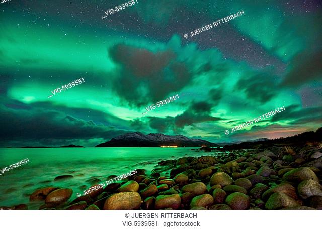 Aurora Borealis or northern lights over winter landscape in fjord of Kaldfjord, Tromvik, Tromso, Troms, Norway, Europe - Tromsoe, Troms, Norway, 28/10/2017