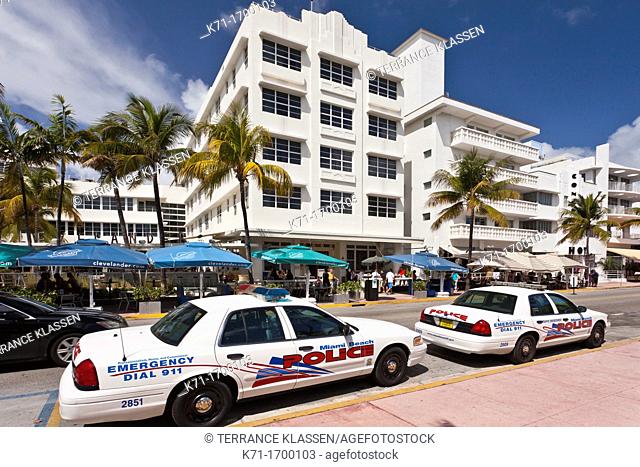Miami Beach police cars and Art Deco architecture along Ocean Drive in Miami Beach, Florida, USA