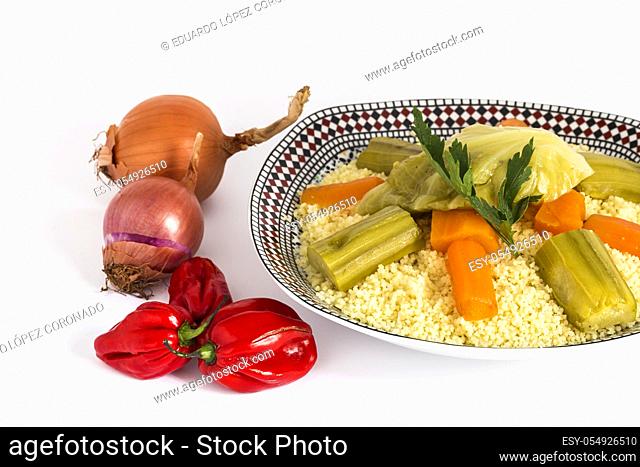 Delicious couscous homemade. Isolated With vegetables on plate. Halal food