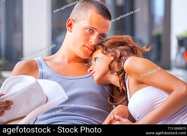 Adolescents teens couple are cuddling together