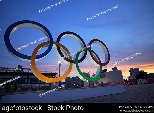 21 July 2021, Japan, Tokio: Olympic rings stand in the evening twilight. The Olympic Games 2020 Tokyo will take place from 23.07.2021 to 08.08.2021