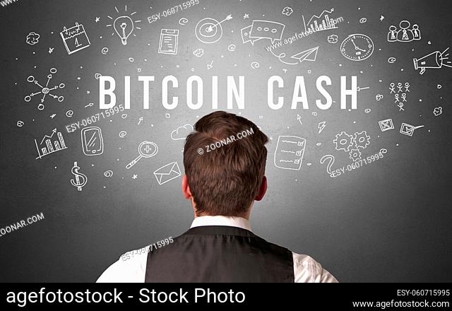 Rear view of a businessman with BITCOIN CASH inscription, modern business concept