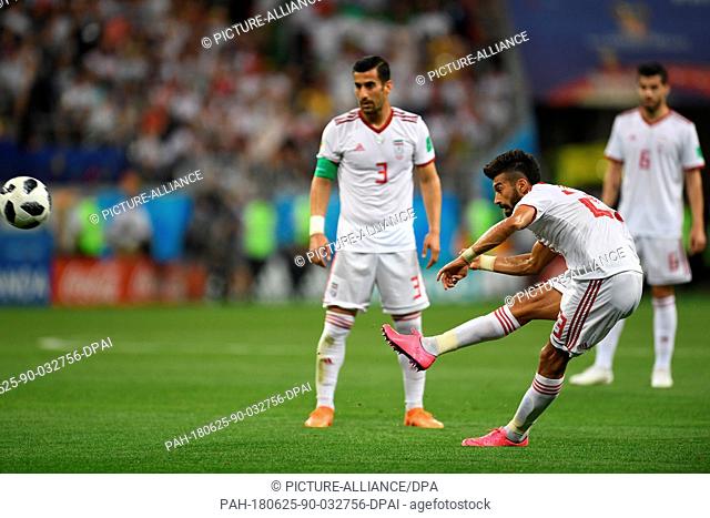 25 June 2018,  Russia, Saransk: Soccer: FIFA World Cup 2018, Iran vs Portugal, group stages, group B, 3rd matchday: Iran's Ramin Rezaeian shoots a free kick