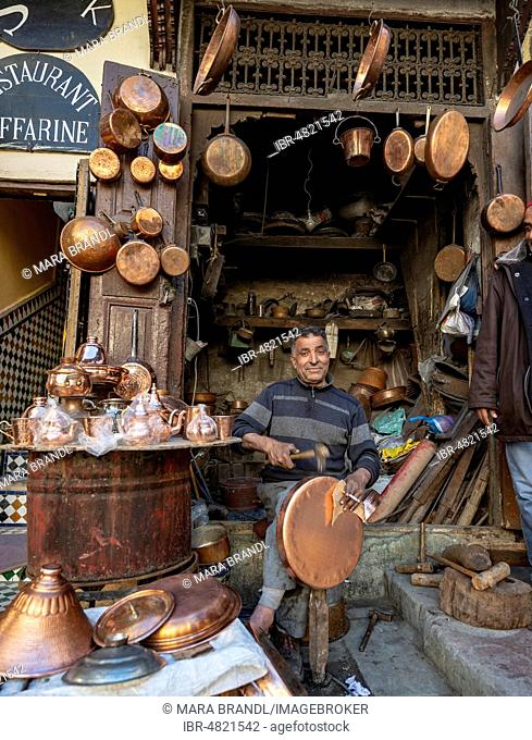 Coppersmith at work, copper market, Seffarine Square, Fes el Bali, Fez, Morocco