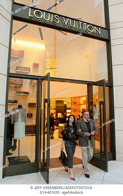 Louis Vuitton, couple, age difference. Upscale shopping, Rodeo Drive, Beverly Hills, California. USA