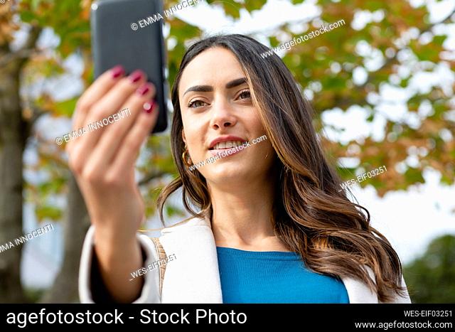 Businesswoman on video call through smart phone