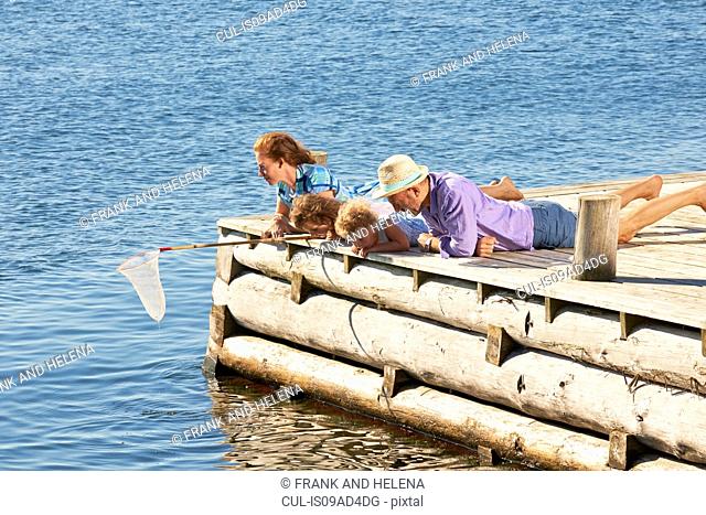 Family fishing on pier, Utvalnas, Gavle, Sweden