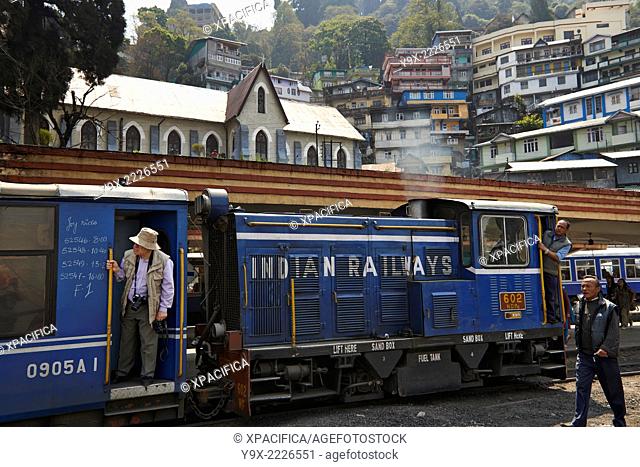 Tourists and locals board and depart The Darjeeling Himalayan Railway station. Known as the ""Toy Train"", it is a 2 ft (610 mm) narrow gauge railway that runs...