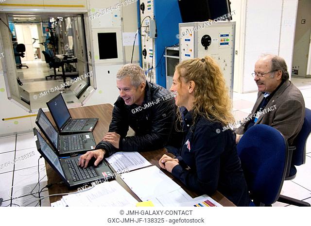 NASA astronaut Steve Swanson (left), Expedition 39 flight engineer and Expedition 40 commander, participates in a training session in the Jake Garn Simulation...