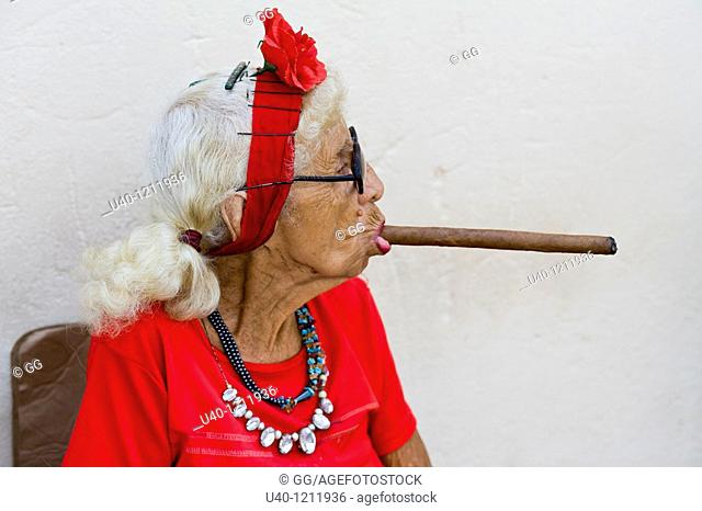 Cuba, old woman smoking cigar