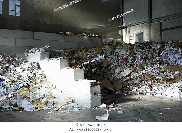 Large heaps of paper in recycling center