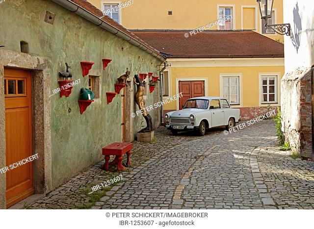 Typical GDR-car Trabant parking in an alleyway in the historic centre of Ceský Krumlov, Czech Republic, Europe