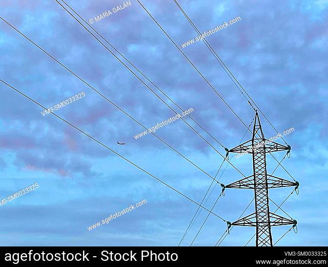 Electricity pylon and cloudy sky