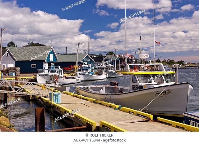 Fishing boats tied up to the wharf in the town of North Rustico, North Rustico Harbour, Gulf of St Lawrence, Highway 6, Blue Heron Coastal Drive, Queens