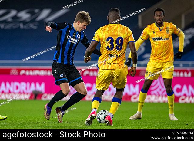 Club's Eduard Sobol and STVV's Mory Konate fight for the ball during a soccer match between Club Brugge KV and Sint-Truiden VV