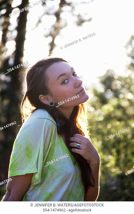 A happy young caucasian woman outdoors
