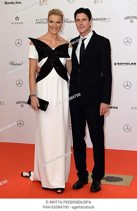 Former skiier Maria Hoefl-Riesch and her husband Marcus Hoefl arrive on the red carpet area at the Stage Theater before the Bambi Awards at Potsdamer Platz...
