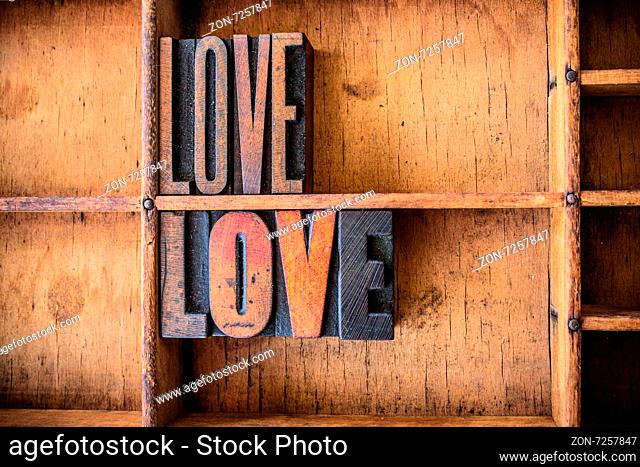 The word LOVE written in vintage wooden letterpress type in a wooden type drawer