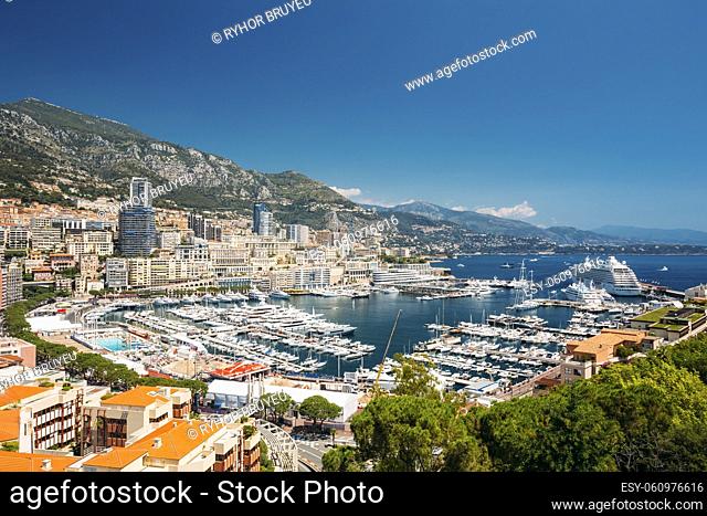 Monaco, Monte Carlo cityscape. Real estate architecture on mountain hill background. Many high-rise buildings in downtown area