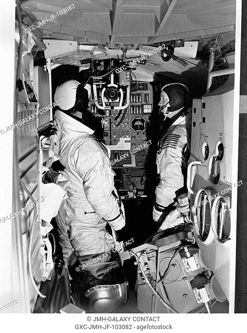 Two members of the Apollo 9 prime crew participate in simulation training in the Apollo Lunar Module Mission Simulator (LMMS) at the Kennedy Space Center (KSC)