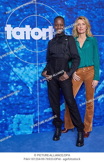 03 December 2018, Hamburg: The actresses Florence Kasumba (l) and Maria Furtwängler are standing in front of a logo wall at an NDR photo shoot of the new...
