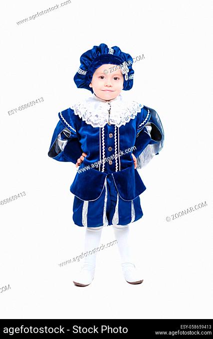 Cute boy posing in studio dressed in a blue prince costume on an isolated background