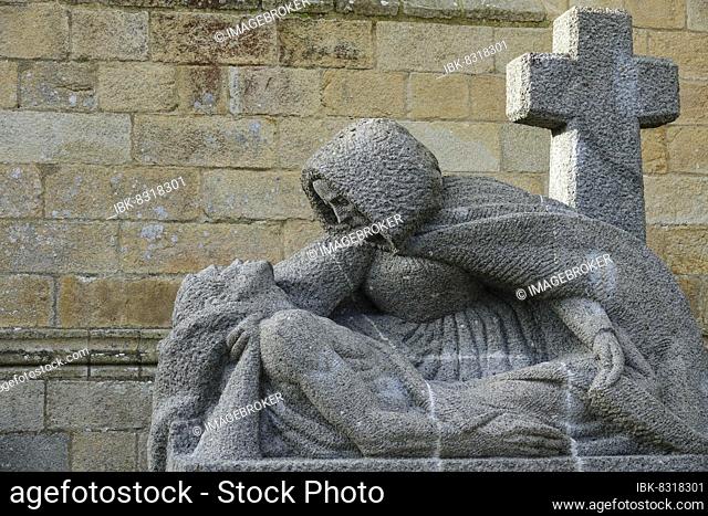 Modern granite Pieta in front of the Gothic cathedral of Saint-Paul Aurélien, Saint-Pol-de-Leon, department of Finistere Penn ar Bed, region of Brittany Breizh