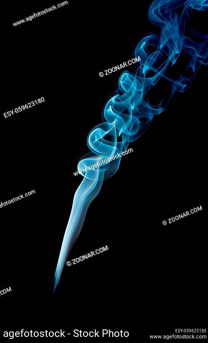 Abstract smoke in blue on a black studio background
