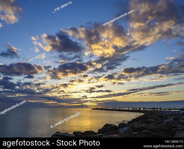 Sunset over jetty and calm flat jetty, Gulf of Mexico from Venice Florida USA