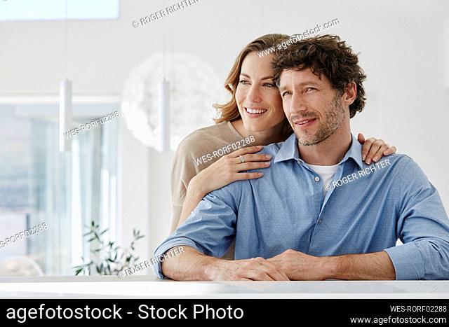 Portrait of smiling affectionate couple in a villa