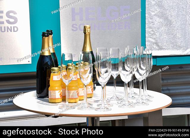 28 April 2022, North Rhine-Westphalia, Cologne: Champagne bottles, champagne glasses and orange juice are on a bar table Photo: Horst Galuschka/dpa
