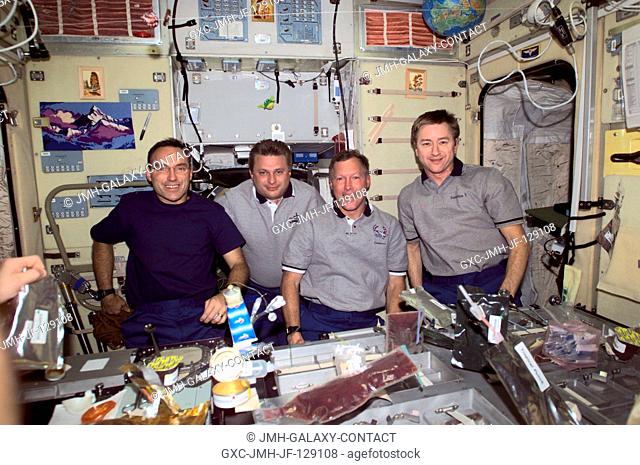 Astronaut Carl E. Walz (left), Expedition Four flight engineer; cosmonaut Yuri I. Onufrienko, Expedition Four mission commander; along with astronauts Dominic L