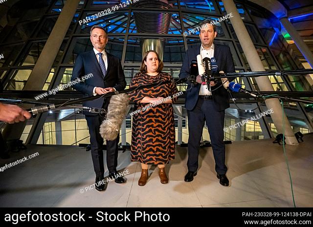 28 March 2023, Berlin: Coalition party leaders Lars Klingbeil (SPD, r-l) Ricarda Lang (Greens) and Christian Lindner (FDP) speak in the Bundestag after the...