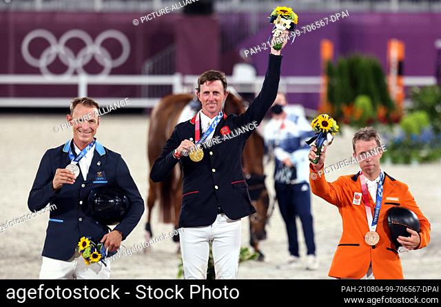 04 August 2021, Japan, Tokio: Equestrian Sport/Jumping: Olympics, individual, final, jump-off, at Equestrian Park. Great Britain's Ben Maher (M) celebrates his...