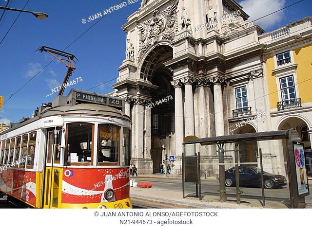 The popular Tramway 28 passing by the Arco do Triunfo (19th century) and official buildings. Praça do Comércio, also known as Terreiro do Paço , Baixa, Lisbon