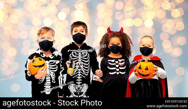 children in halloween costumes and reusable masks