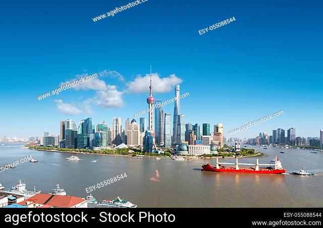 shanghai skyline and cityscape, large ship on the beautiful huangpu river
