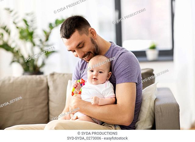 happy father with little baby daughter at home