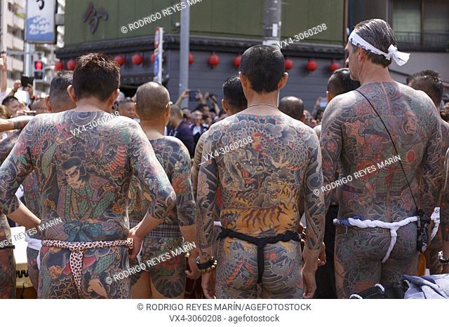 Participants showing their full body tattooed, possibly members of the Japanese mafia or Yakuza, attend the Sanja Matsuri in Asakusa district on May 20, 2018