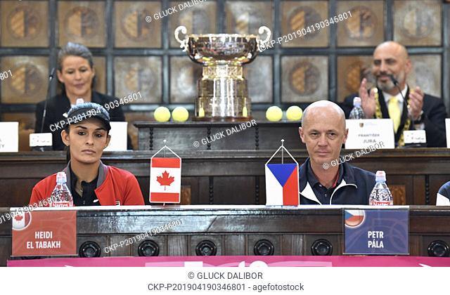 Clare Wood of ITF, backward left, and Prostejov Mayor Frantisek Jura during drawing lots for the Fed Cup match between Czech Republic and Canada, in Prostejov