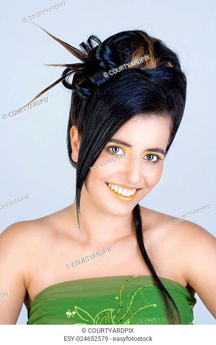 Portrait of a Young Woman with Colorful Makeup and Fancy Hairstyle
