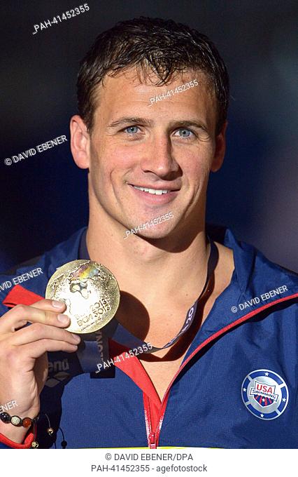 Gold medalist Ryan Lochte of the USA smiles after the men's 200m Individual Medley final of the swimming event of the 15th FINA Swimming World Championships at...