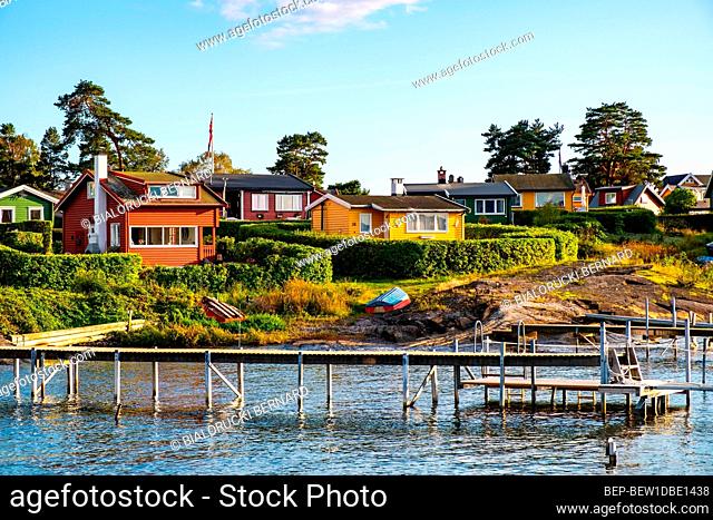 Oslo, Ostlandet / Norway - 2019/09/02: Panoramic view of Lindoya island on Oslofjord harbor with Lindoya Vest marina and summer cabin houses at shoreline in...