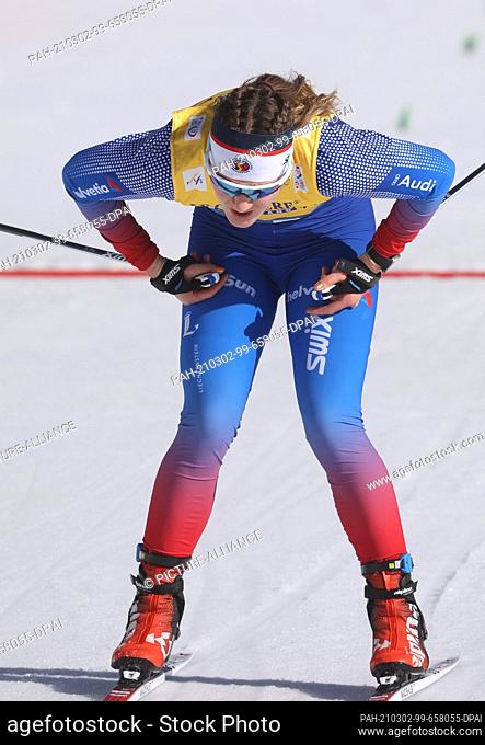02 March 2021, Bavaria, Oberstdorf: Nordic skiing: World Championships, cross-country skiing - individual. Nina Riederer from Liechtenstein crosses the finish...