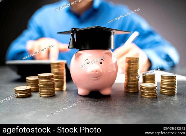 College Piggy Bank With Graduation Hat. Education Piggybank