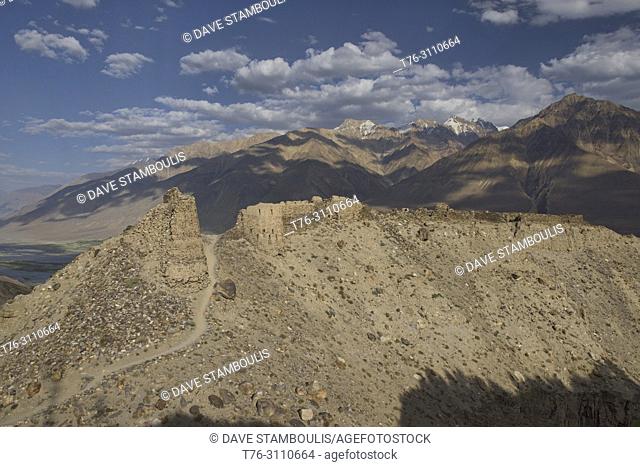 The Yamchun Fort ruins rise over the Wakhan Valley and Afghanistan Hindu Kush, Vikchut, Tajikistan