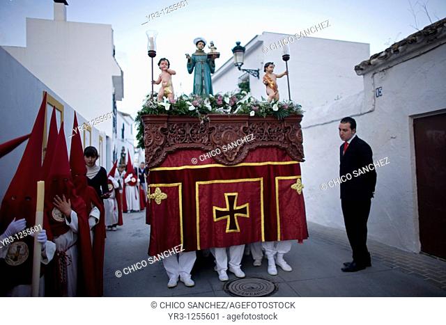 Penitents walk in a street during Easter Holy Week celebrations in Espera village, Cadiz province, Andalusia, Spain