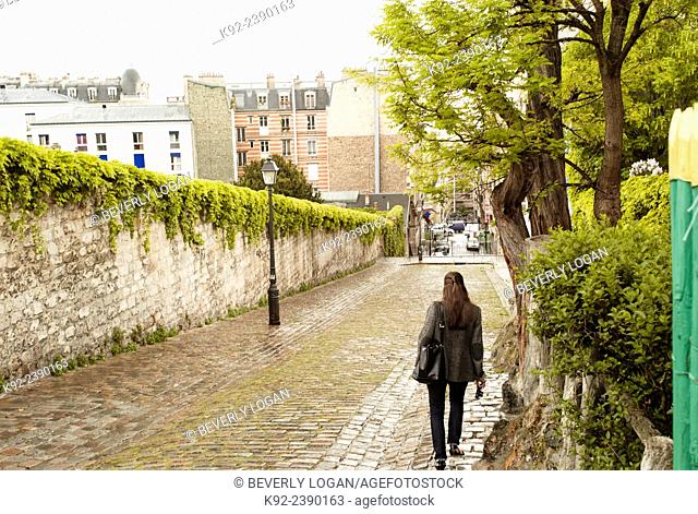 Woman walking on a Paris street