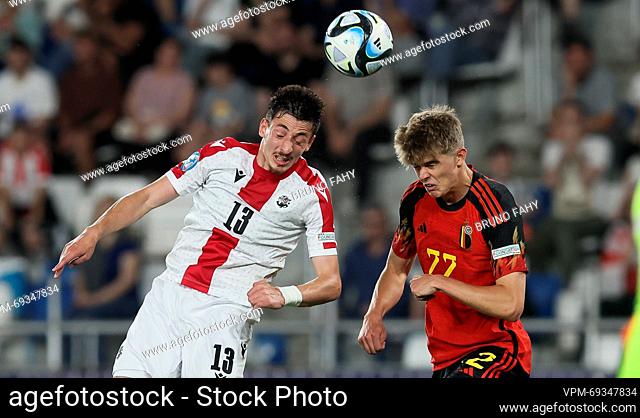 Georgia's Giorgi Gocholeishvili and Belgium's Charles De Ketelaere fight for the ball during the second game of the group stage (group A) between Georgia and...