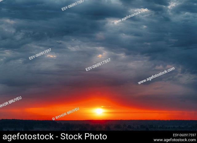 Dramatic Sky With Sunrise Sun Over Forest